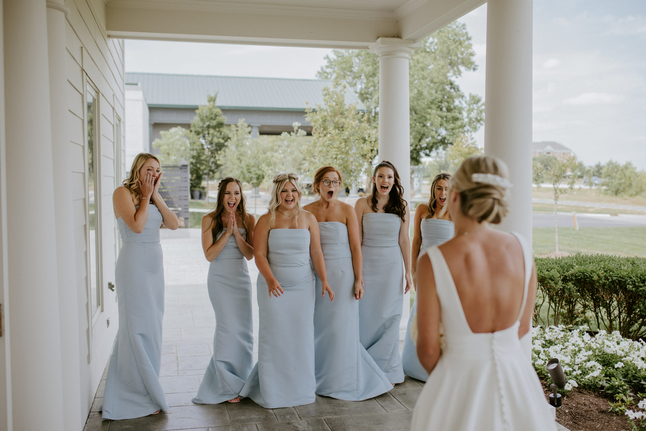 Bride's First Look with Bridesmaids in Light Blue Dresses