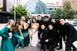 Bridal Party poses in front of Indianapolis Artsgarden