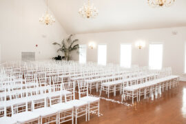 Inside view of Ritz Charles wedding chapel with white chairs