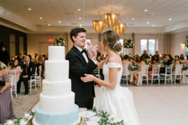 Ritz Charles Bride and Groom Feeding Each Other Wedding Cake